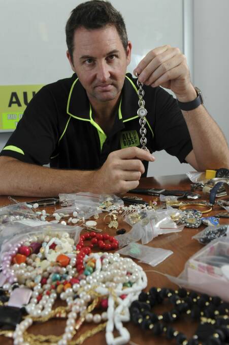 AllBids.com.au chief executive Rob Evans with some of the lost or stolen jewellery from an Australian Federal Police lot set to be auctioned  this week.  Photo: Graham Tidy