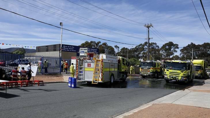 ACT Fire Brigade members at the scene of a fire at Brookes Street in Mitchell. Photo: Jeffrey Chan