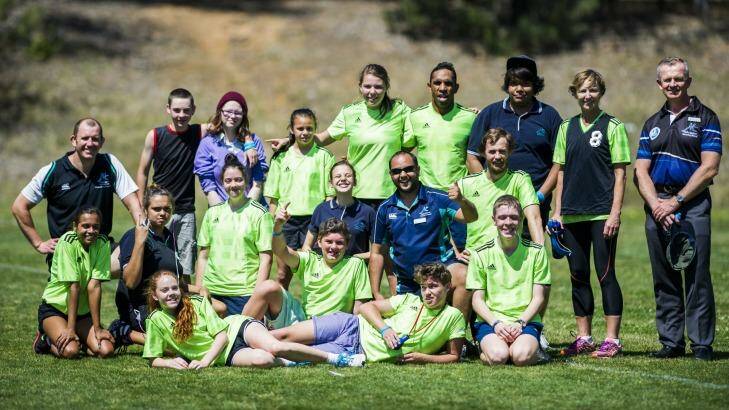 Ex Brumbies and Wallabies player Andrew Walker with the Melba Copland Secondary School handball team at the Inaugural Buroinjin Challenge to raise awareness of Indigenous suicide. Photo: Rohan Thomson