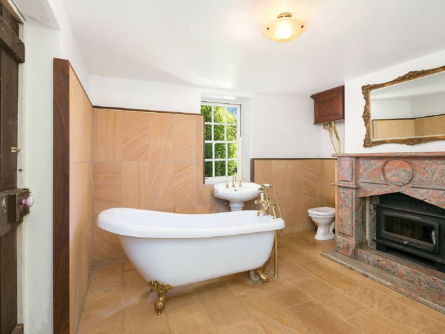 The renovated bathroom, perfect for having a soak while sipping a scotch. Photo: Supplied