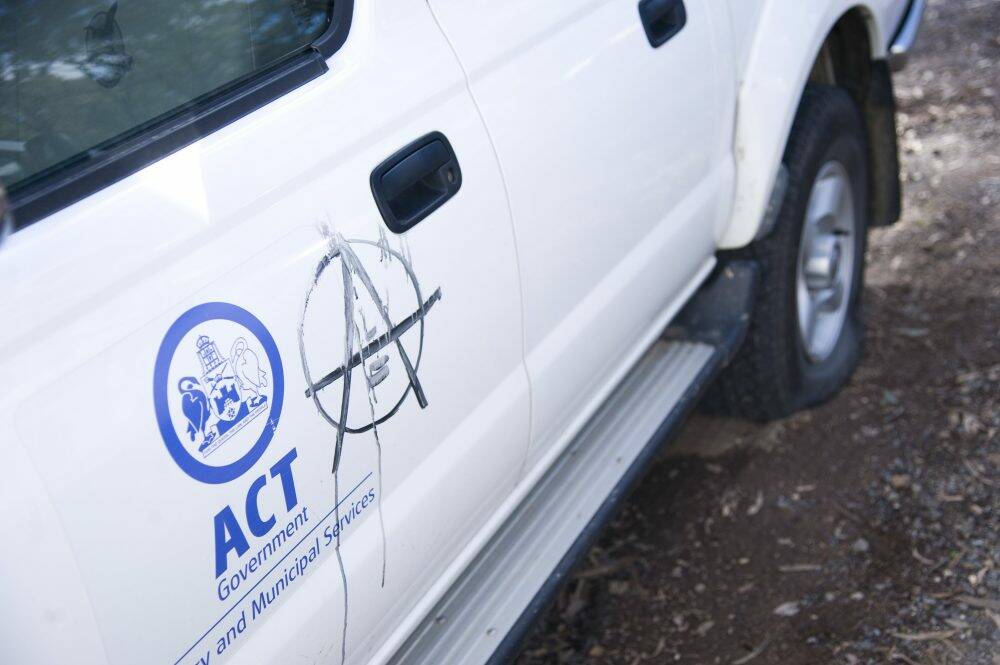 Graffiti: An anarchy symbol was painted on at least one of the vehicles. Photo: Elesa Kurtz