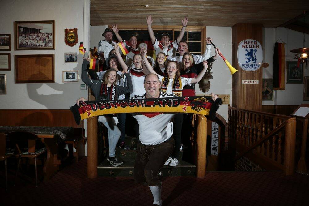 Hans Stoehr, front, with fellow German fans in full voice at the Harmonie German Club of Canberra for the World Cup final between Germany and Argentina.  Photo: Jeffrey Chan