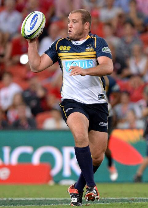 Ben Alexander of the Brumbies looks to offload. Photo: Getty Images