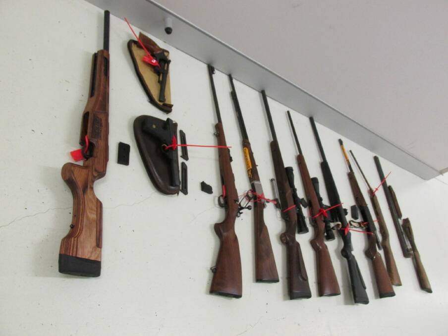 Police seized a number of firearms plus ammunition from a Fisher property. Photo: ACT Policing