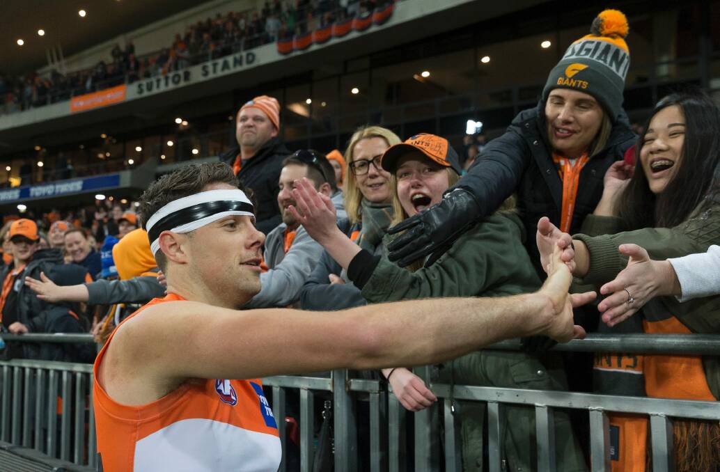 Main man: Josh Kelly enjoys the victory with fans. Photo: AAP