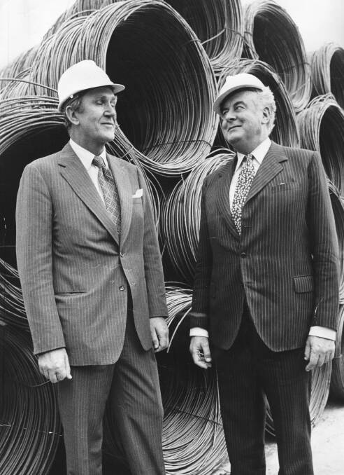 Hard hats for hard heads: Malcolm Fraser and Gough Whitlam at the opening of a BHP steel mill in Geelong in 1974. Photo: John Lamb