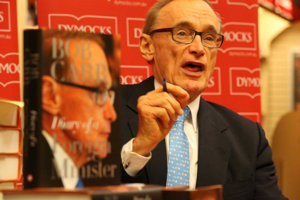 Popular: Bob Carr signs copies of his book. Photo: Peter Rae