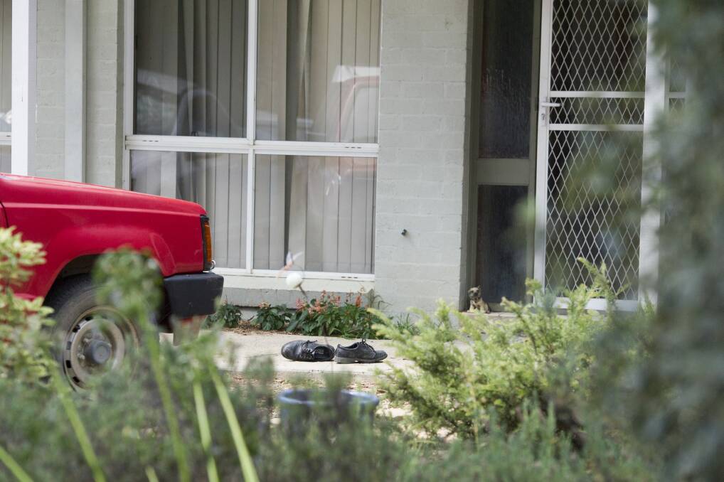 The Calwell home where a woman died remained taped off on Sunday.  Photo: Jay Cronan