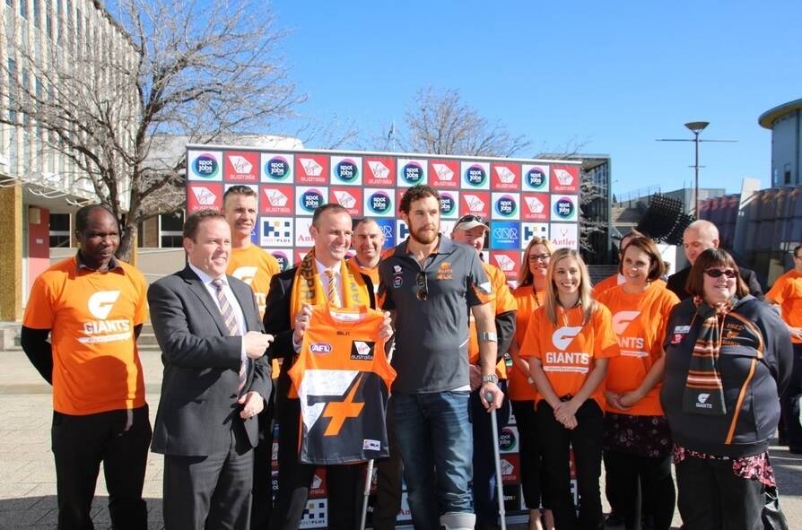 Andrew Barr received a signed Greater Western Sydney Giants guernsey. Photo: Supplied