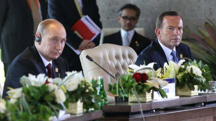 Vladimir Putin and Prime Minister Tony Abbott during the APEC Economic Leaders Meeting. Photo: Alex Ellinghausen
