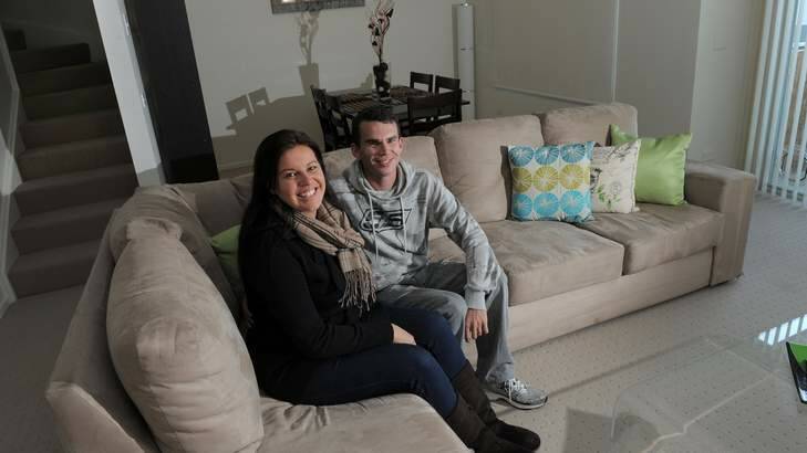 Queanbeyan couple, Nathan Buckley and his wife Tanya Heydon in their apartment. They are hoping to buy land and build a home in Googong. Photo: Graham Tidy