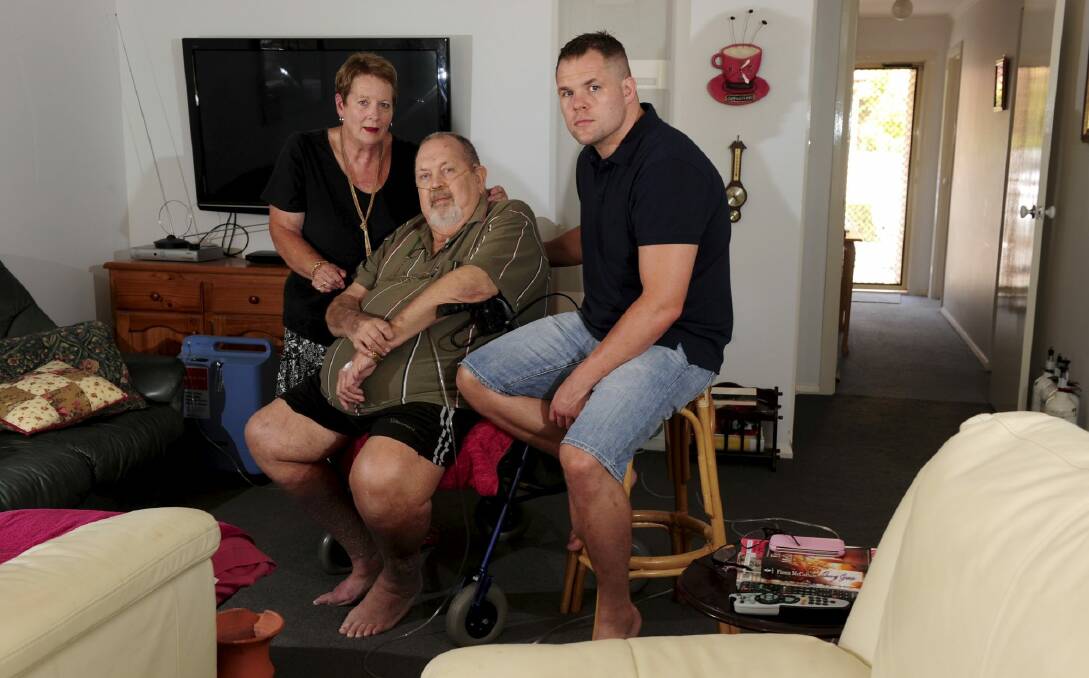 Canberra boxer Ben Edwards with his parents, June and Ray, at their
Charnwood home. Photo: Graham Tidy