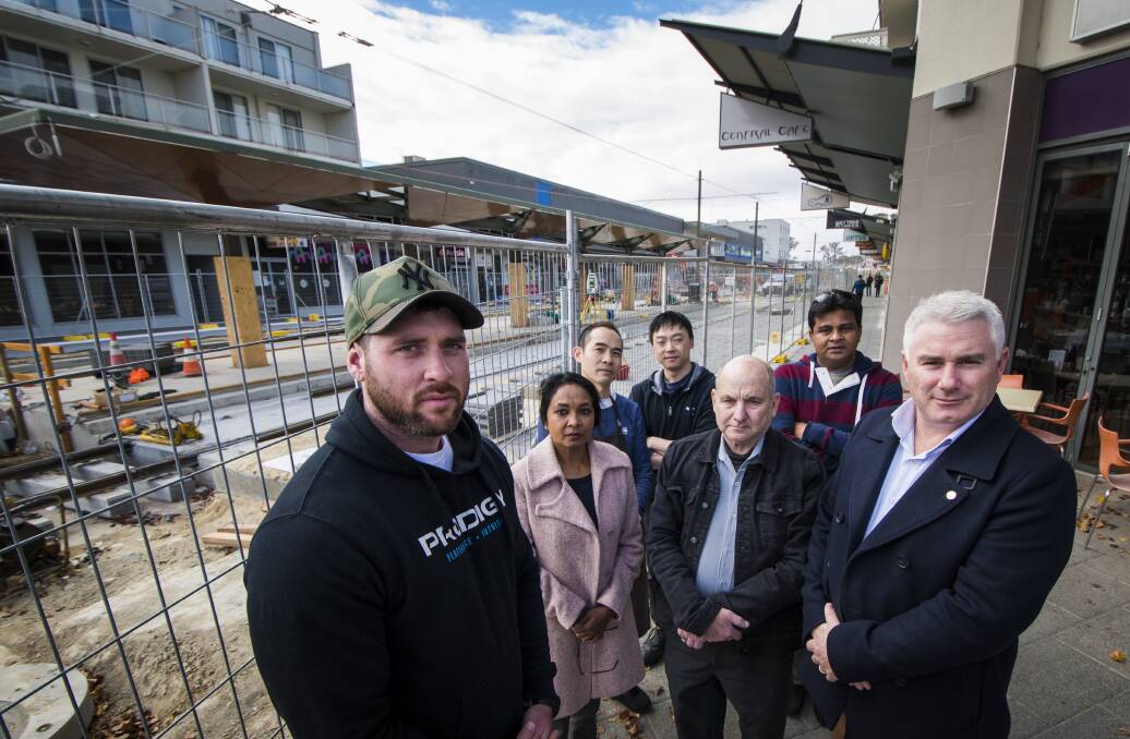 Canberra Liberal James Milligan (right) will next week call for an independent inquiry into the financial impact of light rail construction on Gungahlin businesses. Pictured with business owners Cam McAlister from Prodigy, Radhika Reddy of Gungahlin Sultans Turkish Cuisine, Gary Woo of G tree Cafe, Tang Jong from Asian Tea House, Allan Russell from Diamond Ring Designs and Raj Karingula from Sultans Turkish Cuisine. Photo: Elesa Kurtz