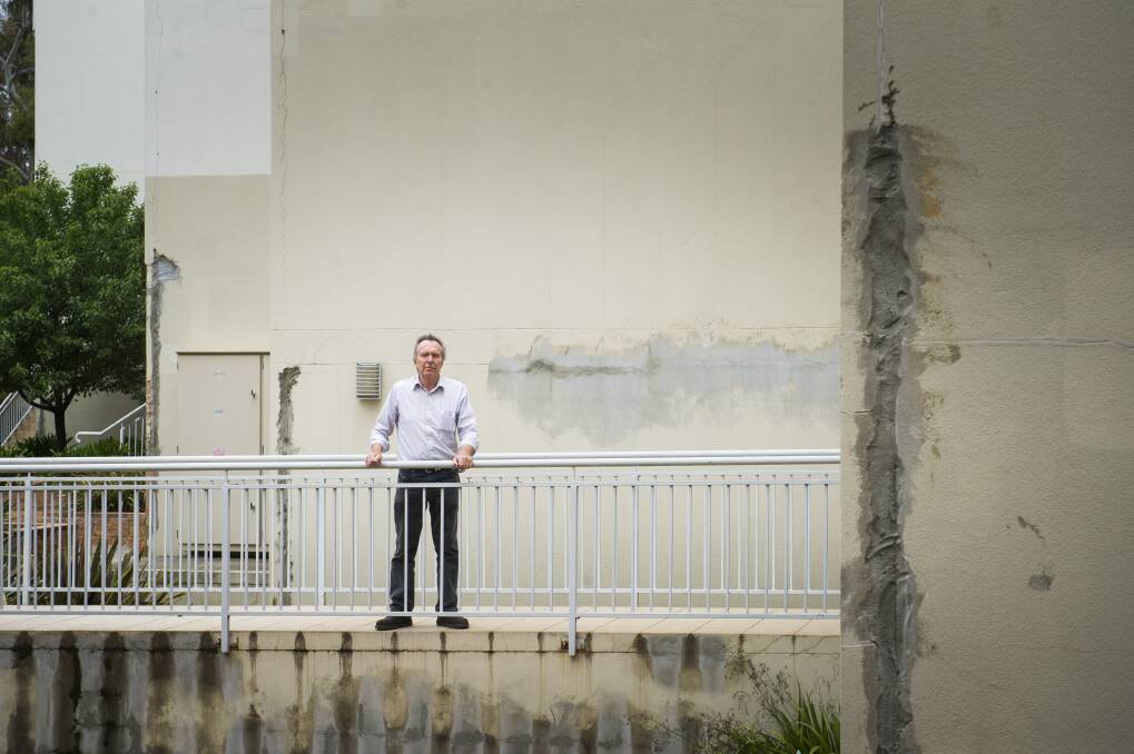 A review of the Elara building, pictured above with apartment owner David Allen, revealed "systemic design practices" which had resulted in defects, according to the structural engineer who conducted it. Photo: Elesa Kurtz
