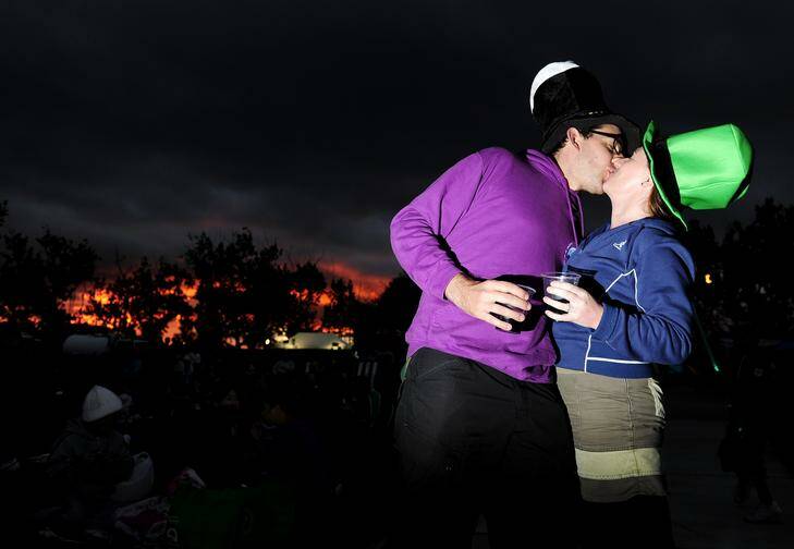 Scott Meyerink and Diane Purcell make the most of St Patrick's Day at Skyfire 2012 on the shore of Lake Burley Griffin, Canberra. Photo: STUART WALMSLEY