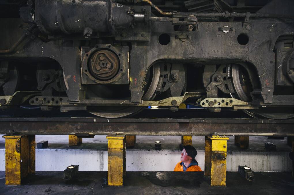 Dale Tyce services a locomotive in the Goulburn workshop. Photo: Rohan Thomson