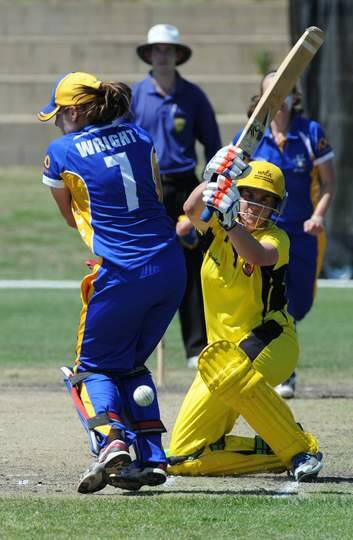 Jenny Wallace gets one past ACT wicketkeeper Laura Wright. Photo: Graham Tidy