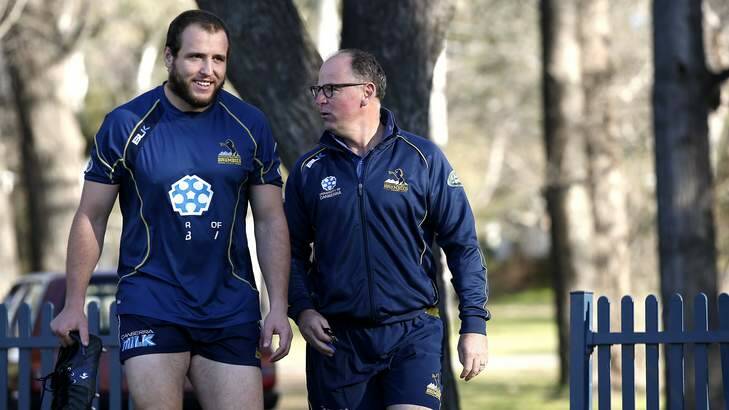 ACT Brumbies player Ben Alexander chats with coach Jake White. Photo: Jeffrey Chan