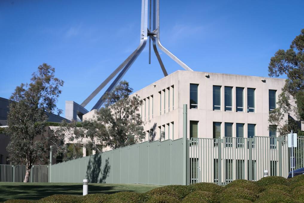 Fencing already surrounds the ministerial entrance at the back of Parliament House. Photo: Alex Ellinghausen