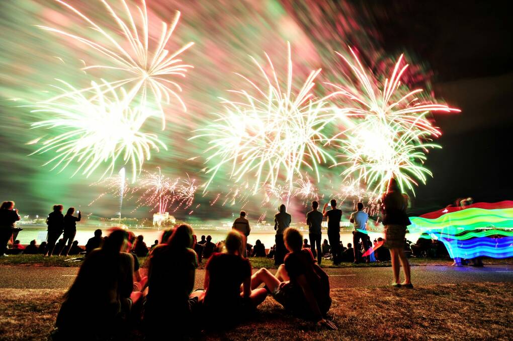 Enjoying the fireworks for skyfire celebrations over Lake Burley Griffin. Photo: Jay Cronan