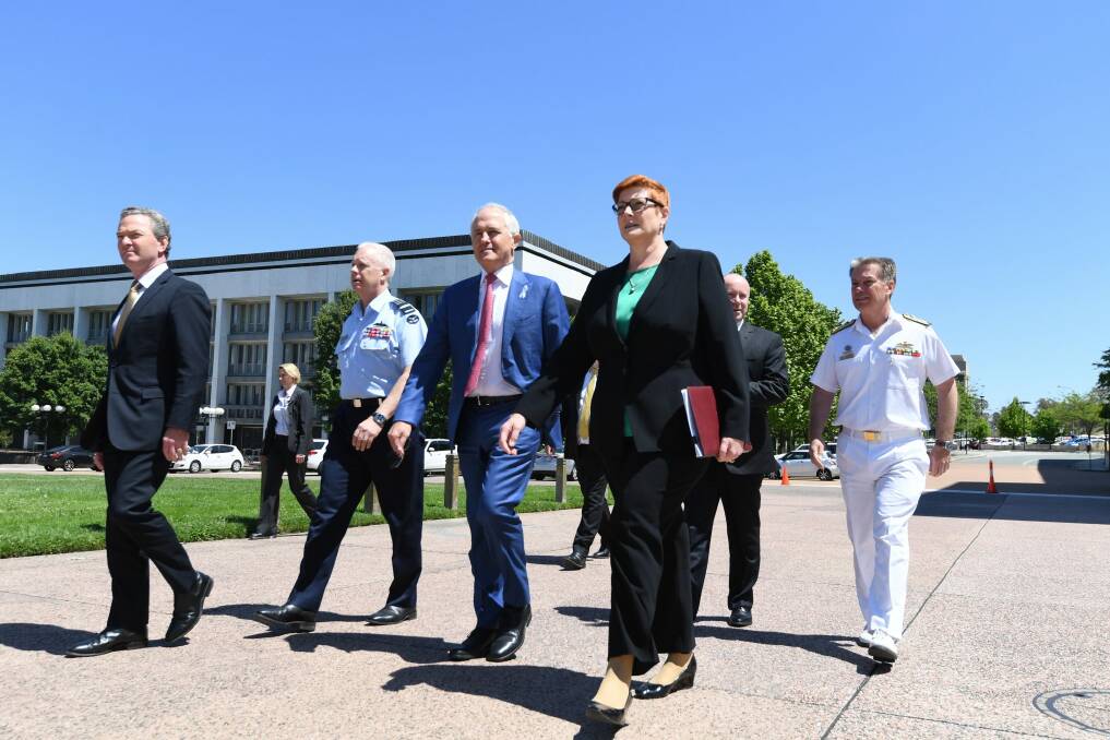 Defence Industry Minister Christopher Pyne, Mr Turnbull and Defence Minister Marise Payne. Photo: AAP
