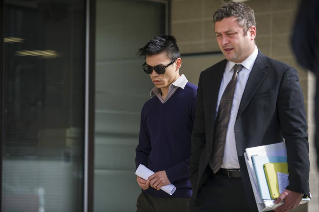 Stanley Hou, left, outside the ACT Magistrates Court in August with his lawyer Kamy Saeedi, right. Photo: Jamila Toderas