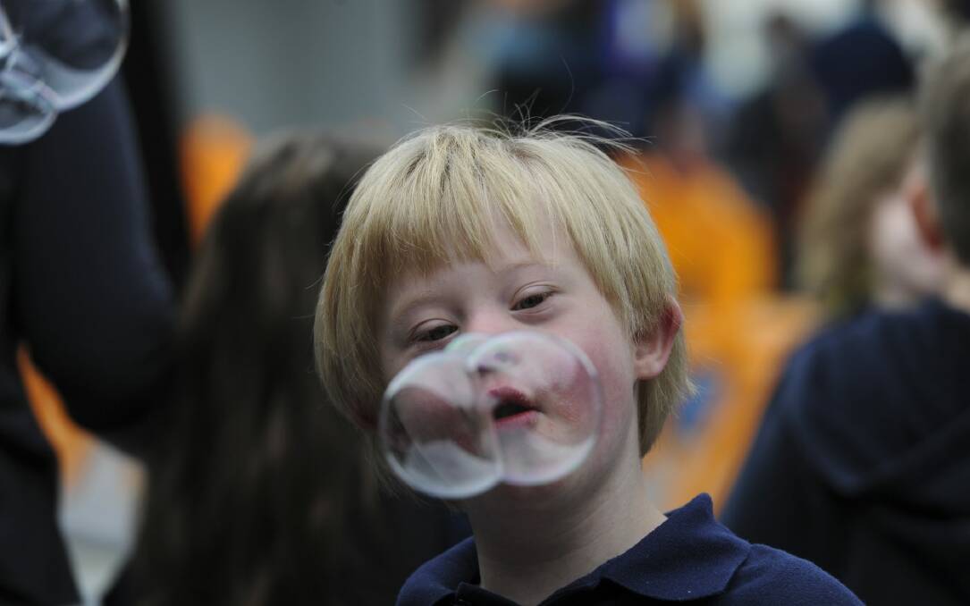 Jack Blackmore, 8, is intrigued by the bubble blowing activity. Photo: Graham Tidy