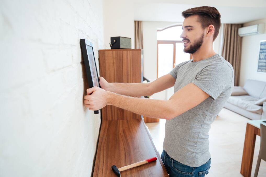 Tenants in the ACT can now more easily modify their homes, including putting up picture hooks. Photo: Shutterstock