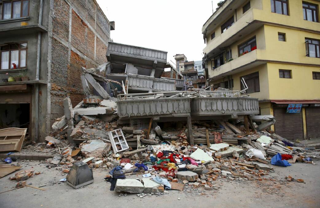 A collapsed building is pictured after an earthquake hit, in Kathmandu, Nepal. Photo: Reuters