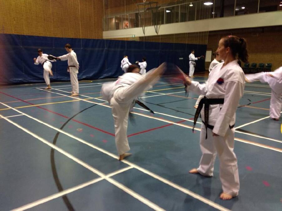 Sparring fun: Training at United Taekwondo Canberra.  Photo: Supplied