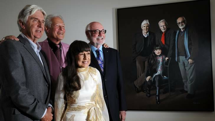 The Seekers - Bruce Woodley, Keith Potger, Athol Guy and Judith Durham in front - pose in front of a painting of themselves by artist, Helen Edwards, at the National Portrait Gallery. Photo: Graham Tidy