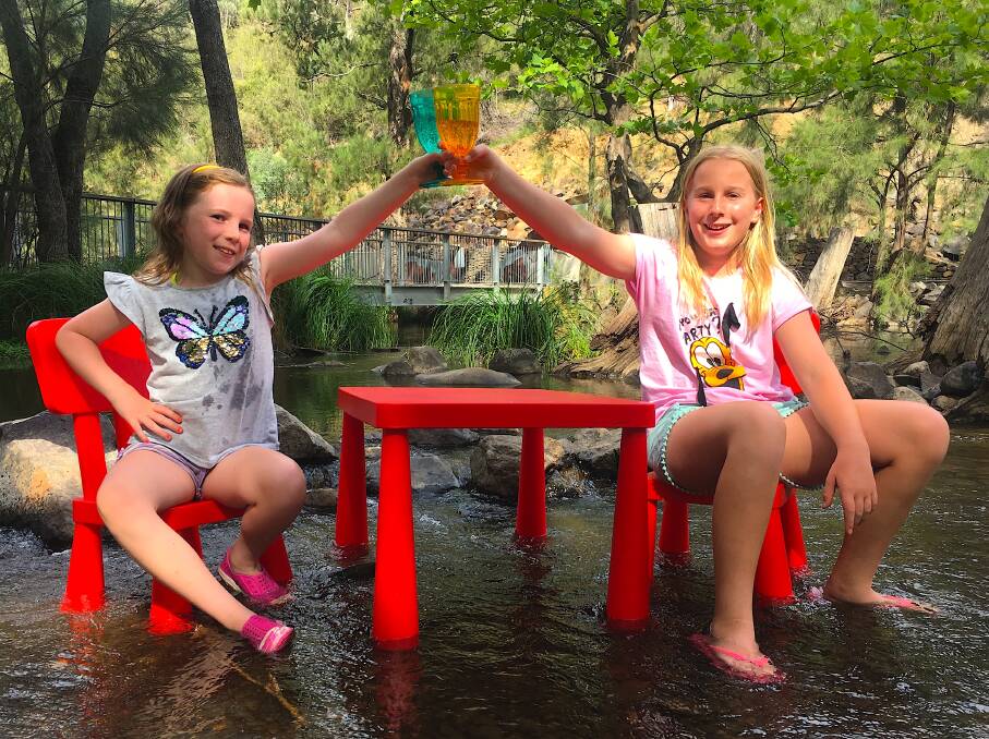 Tim’s daughters celebrate the end of an in-river picnic at the Cotter. Photo: Tim the Yowie Man
