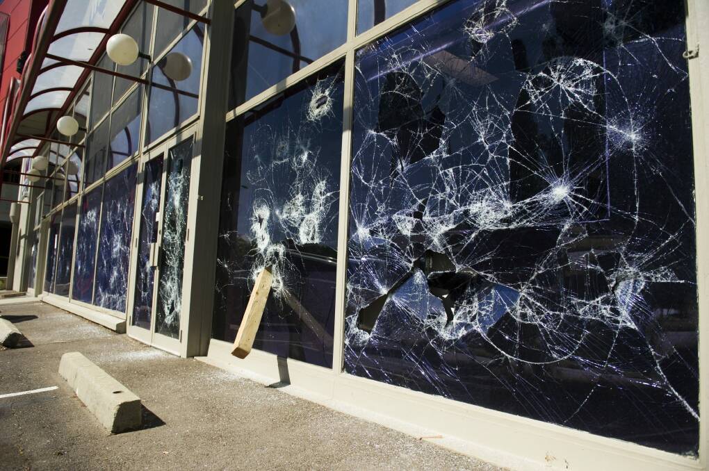 Smashed windows at the WIN TV building on Wentworth Ave, Kingston.
 Photo: Jay Cronan