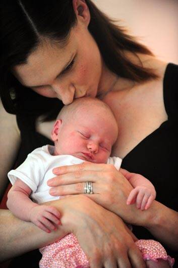 Former model Anneliese Suebert with her first child daughter Camille, 11 days old. Photo: Karleen Minney