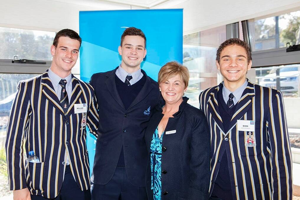 The Canberra Grammar School Eggheads were the highest team fundraisers for this year's World's Greatest Shave, raising $27,000, the most ever raised by an ACT school for the event. Representing the school are William Herse, Lachie Martin and Dion Tsarpalias with the Leukaemia Foundation's Belinda Barnier. Photo: Bob Pillifeant