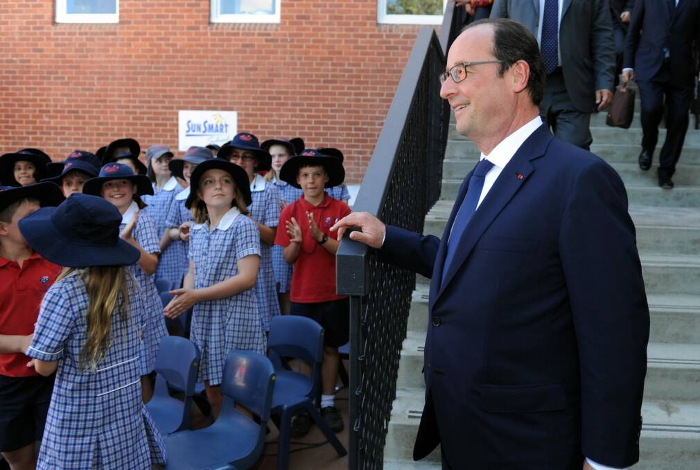 Bonjour: Francois Hollande arrives to deliver a speech at the French Australian School, Telopea Park.  Photo: Graham Tidy