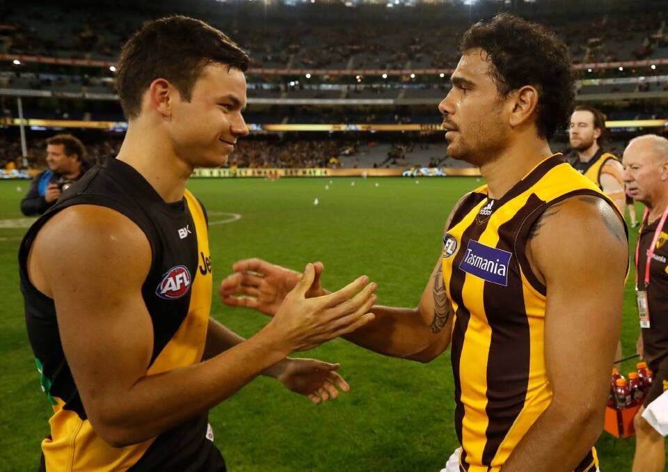 Meeting of Riolis: Daniel Rioli of the Tigers and Cyril Rioli of the Hawks. Photo: AFL Media/Getty Images