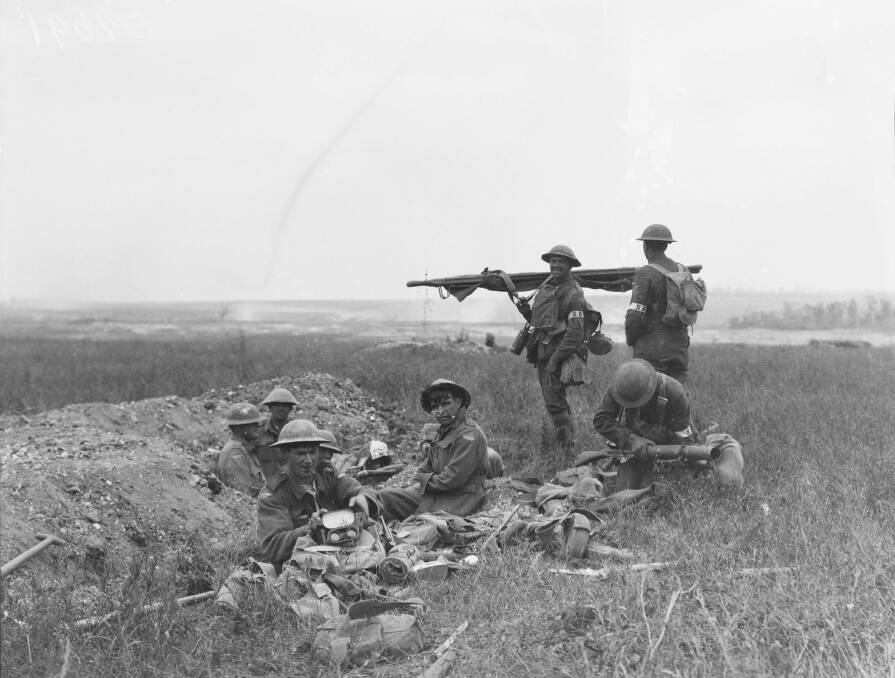 American and Australian stretcher bearers working together in the front line area during the Battle of Hamel. Photo: Australian War Memorial