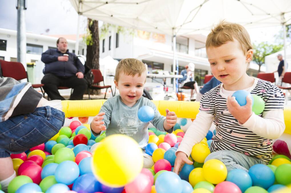 Mason Hutton, one, and Chloe Carwardine, two, in the play area run by the Salvation Army at SouthFest on Saturday. Photo: Dion Georgopoulos