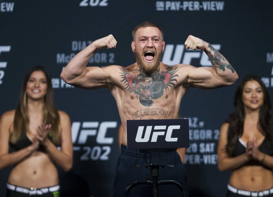 Versatile: Conor McGregor was the first fighter to hold two UFC titles simultaneously.  Photo: AP