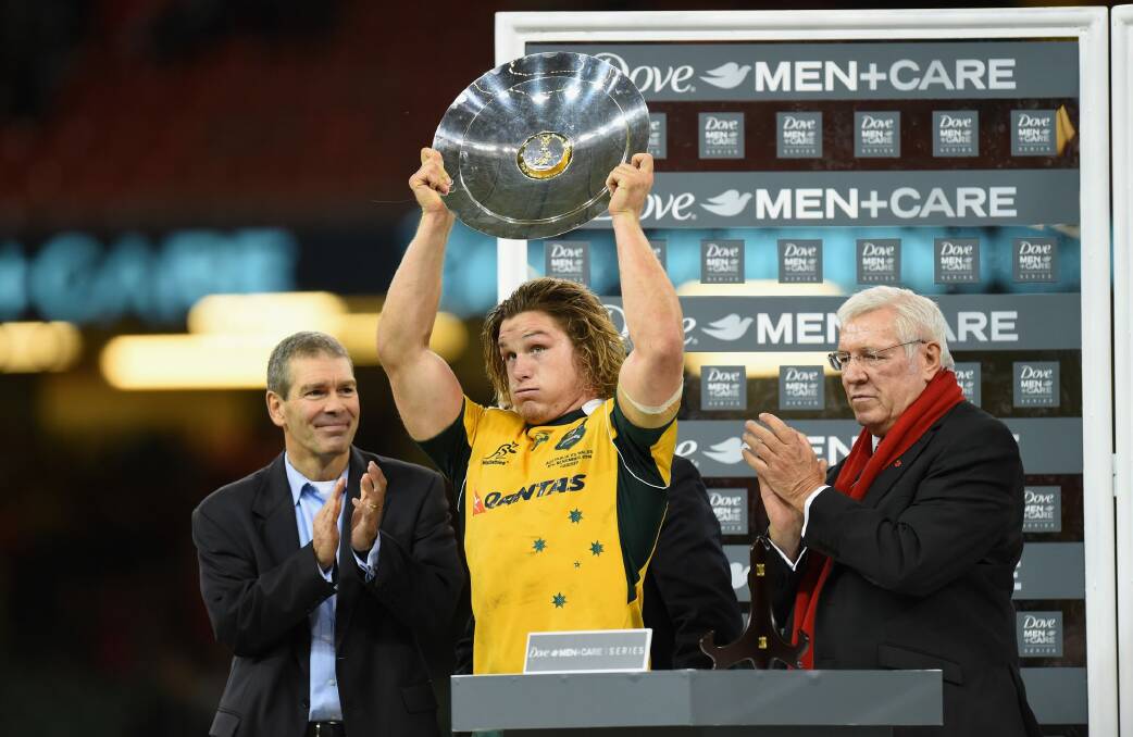 Relieved: Michael Hooper holds up the James Bevan Trophy. Photo: Getty Images