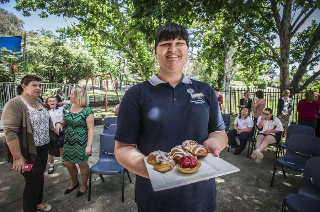 Year 10 student Crystal Owen works as a waitress as SixDegrees cafe celebrates International Day of People with Disability. Photo: Karleen Minney