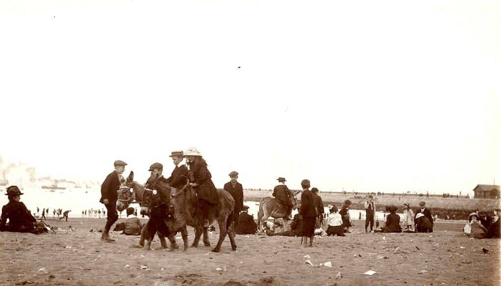 Donkeys and 'Donkey Boys' at Herd Sand, England, 1902.