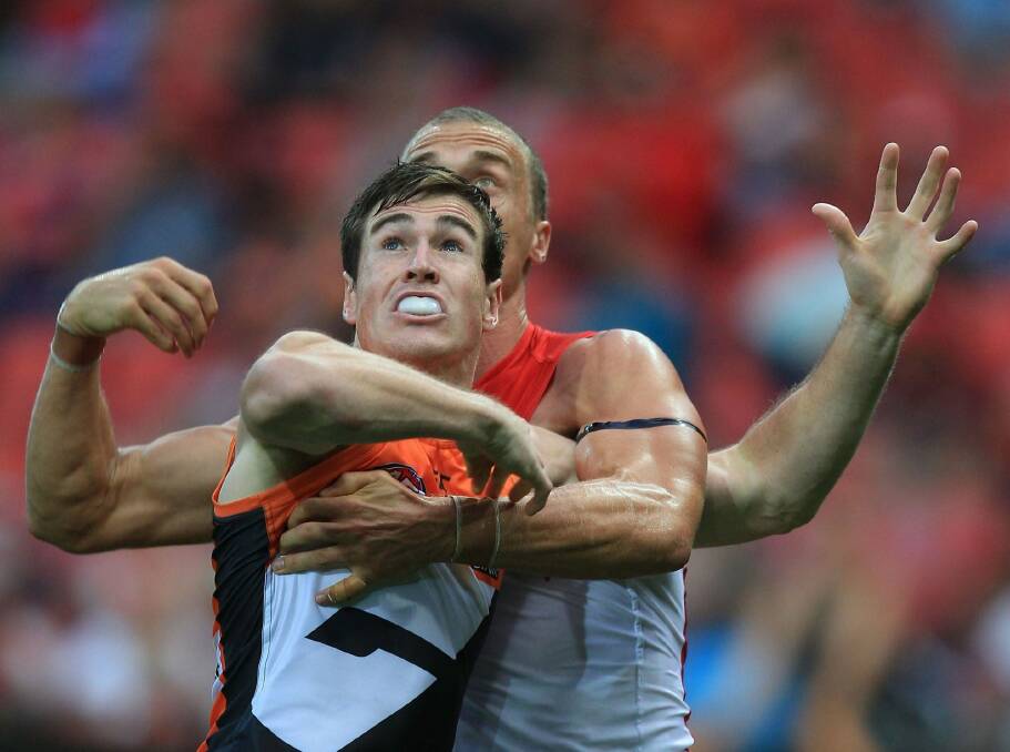 Jeremy Cameron of the Giants and Ted Richards of the Swans contest the ball during the 2014 AFL Season. Photo: Craig Golding