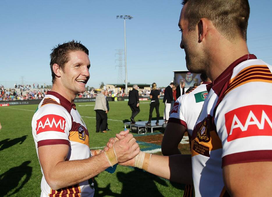 Canberra Raiders players Jarrod Croker and Paul Vaughan celebrate Country's 32-22 win against City in Wagga Wagga on Sunday. Photo: Getty Images