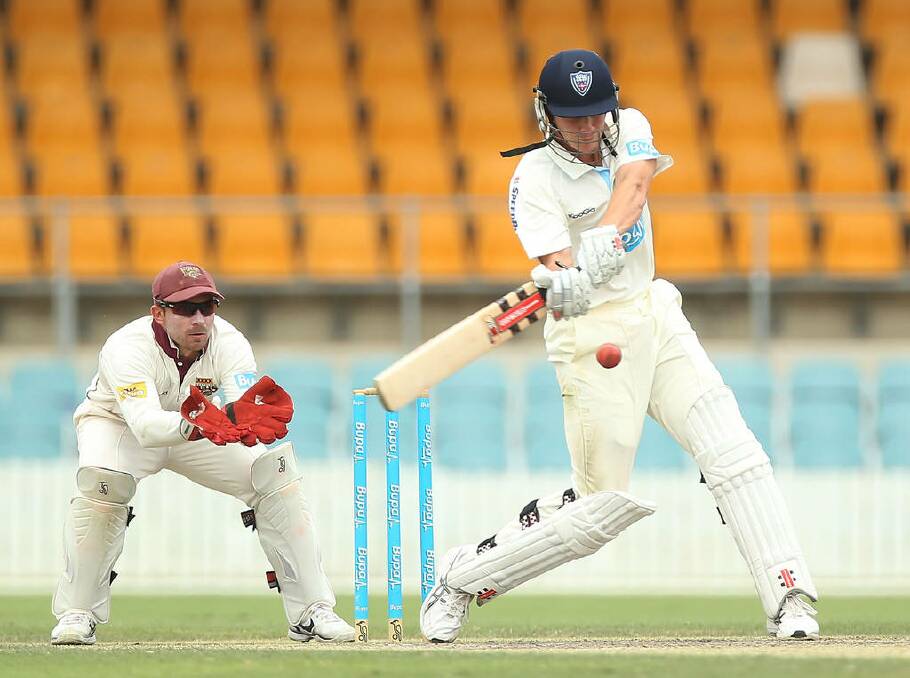 Sean Abbott bats during day four of the Sheffield Shield match against Queensland at Manuka Oval. Photo: Mark Metcalfe