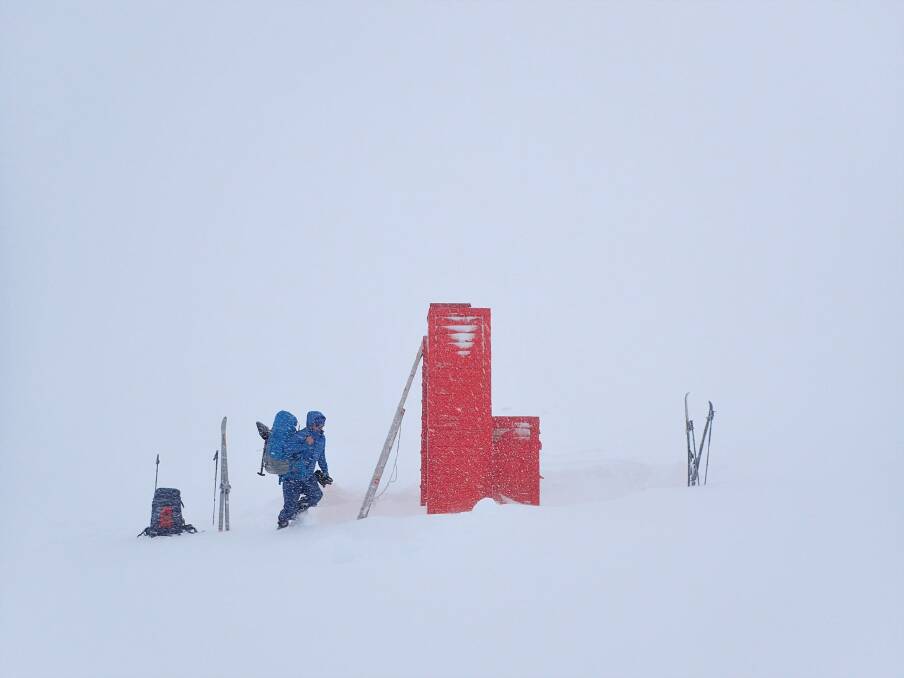 The blizzard closes in on Cootapatamba Hut. Photo: Peter Blunt