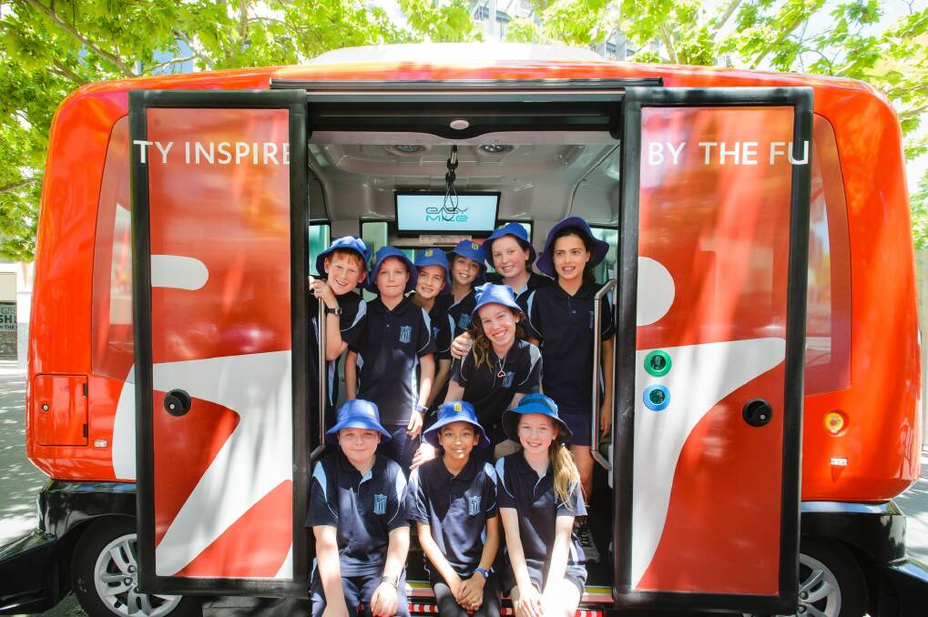 Year 6 students from Ainslie School were among the first to experience riding a driverless shuttle, with rides offered to the public from Friday. Photo: Sitthixay Ditthavong