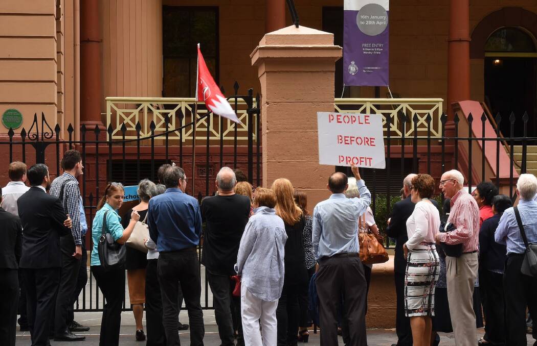 Protesters in front of NSW Parliament House demonstrating against the NSW government's privatisation of the land titles registry in the state. Photo: Kate Geraghty