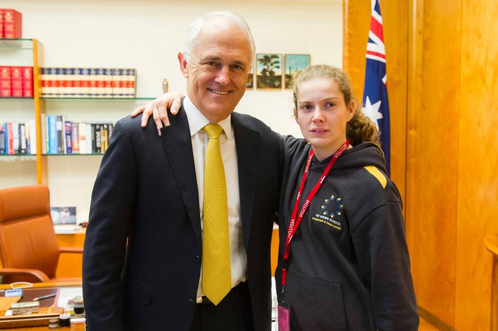 Woden Special School student Ashleigh Edwards meets Prime Minister Malcolm Turnbull after delivering his mail. Photo: Rohan Thomson